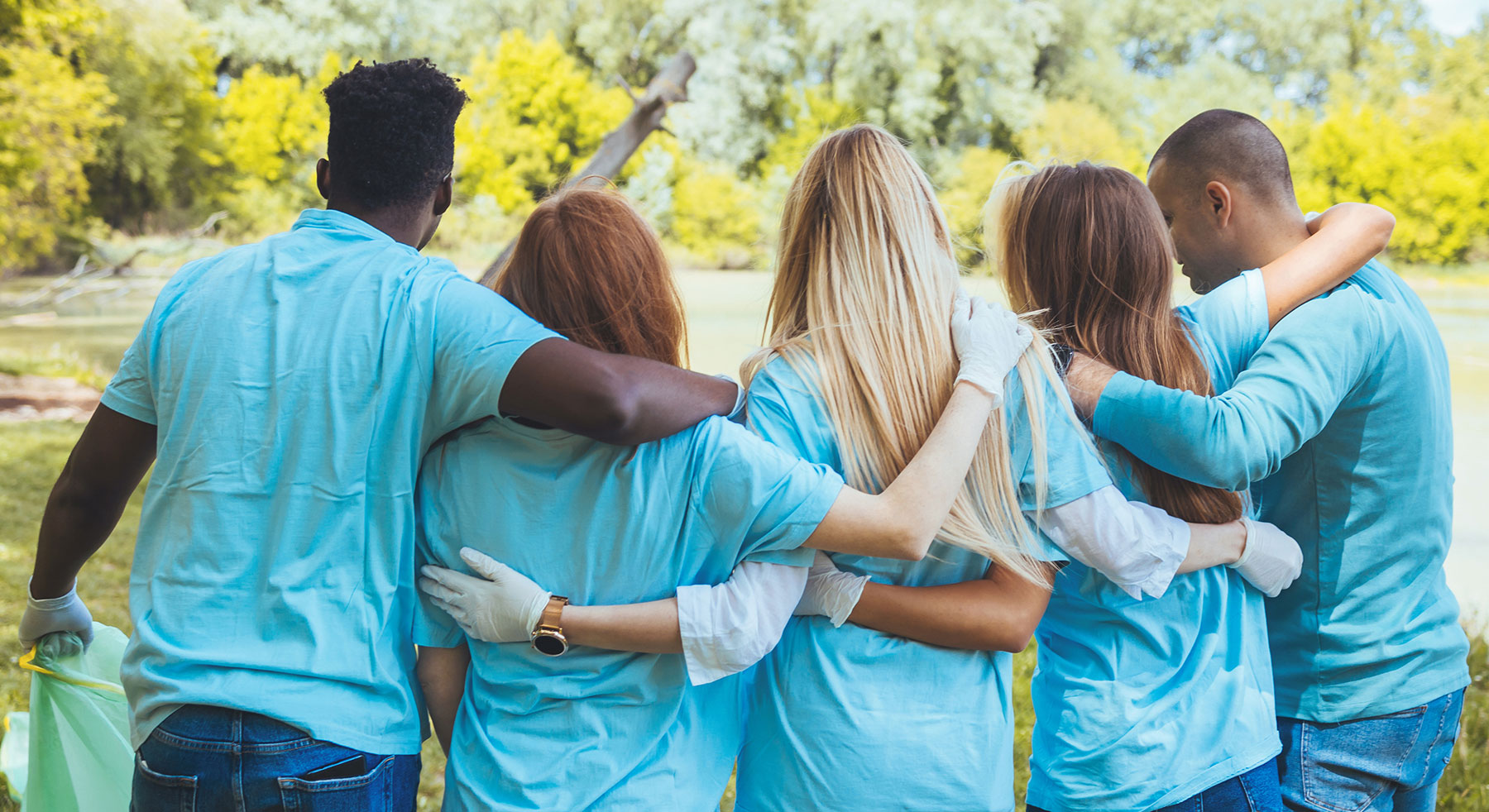 group of people with their arms around each other