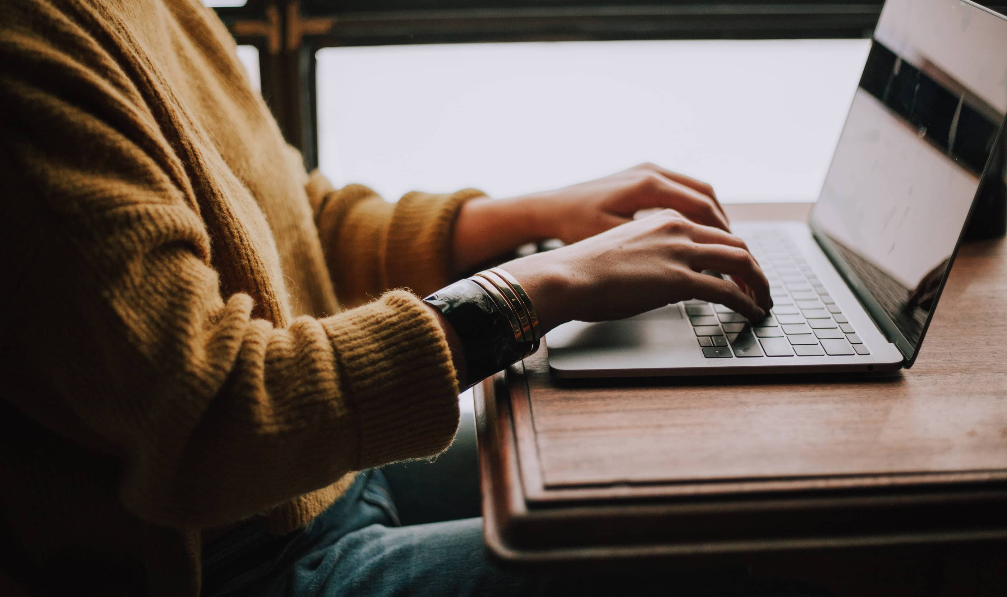 Women Upgrading google analytics to G4 on laptop