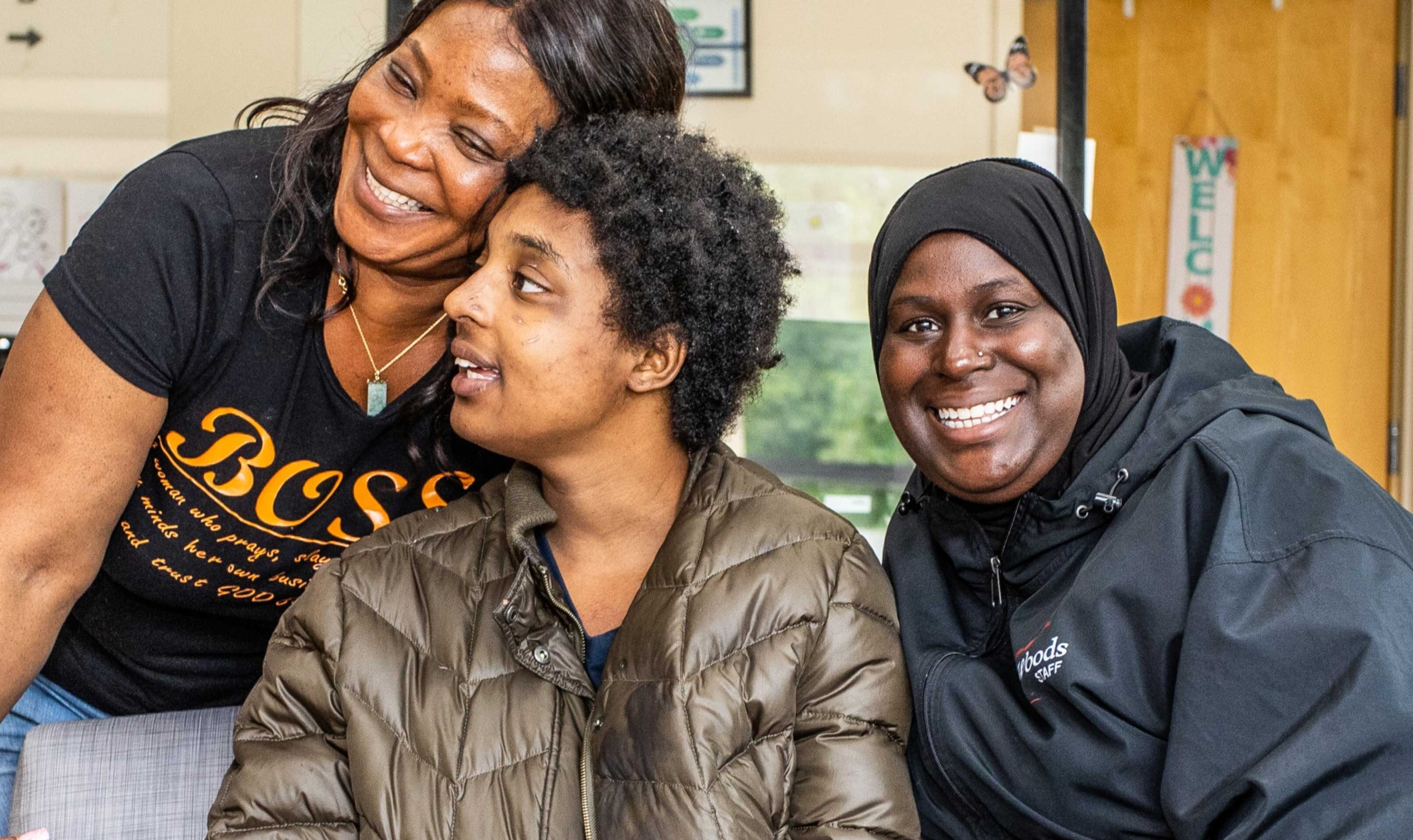 Woods nonprofit case study banner image with three people smiling