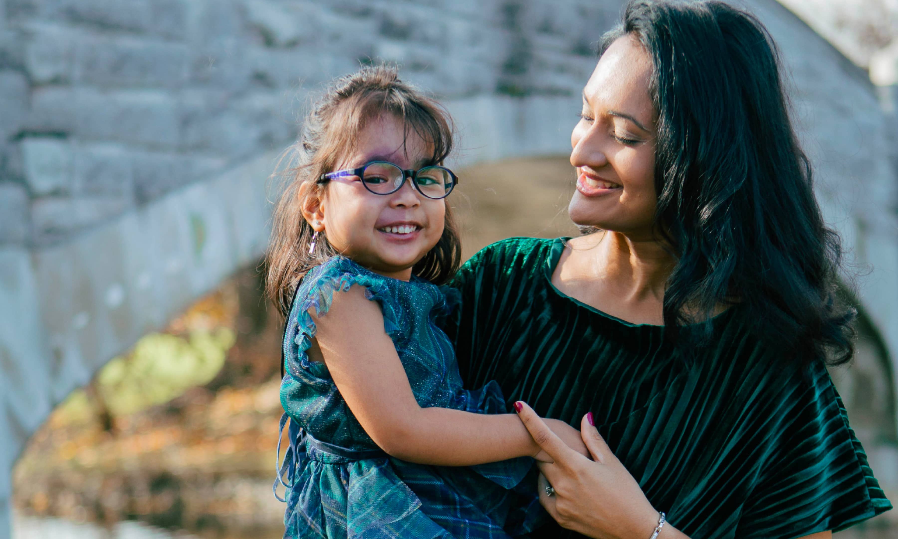 Cure Epilepsy nonprofit case study image of a mother holding her daughter smiling