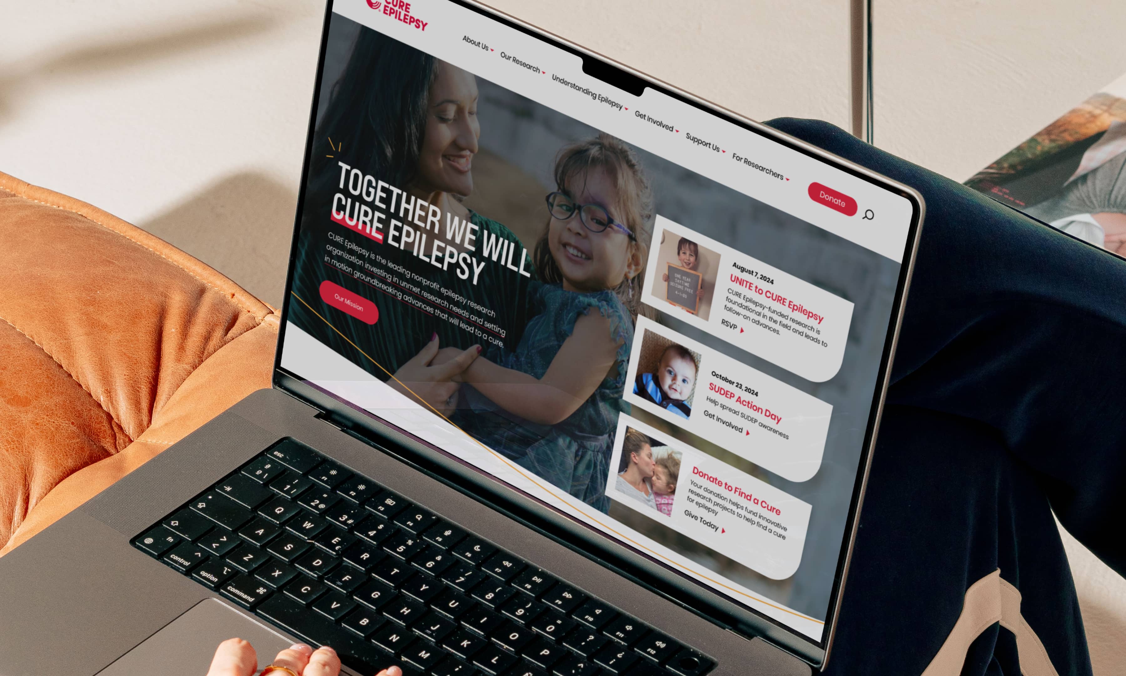 Homepage banner designed for Cure Epilepsy's new website, mocked up on a laptop