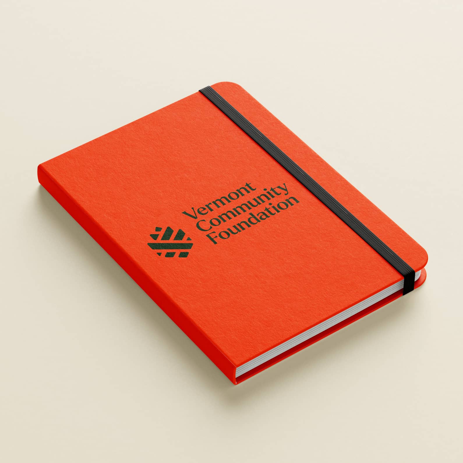 A new visual identity created for Vermont Community Foundation on a notebook