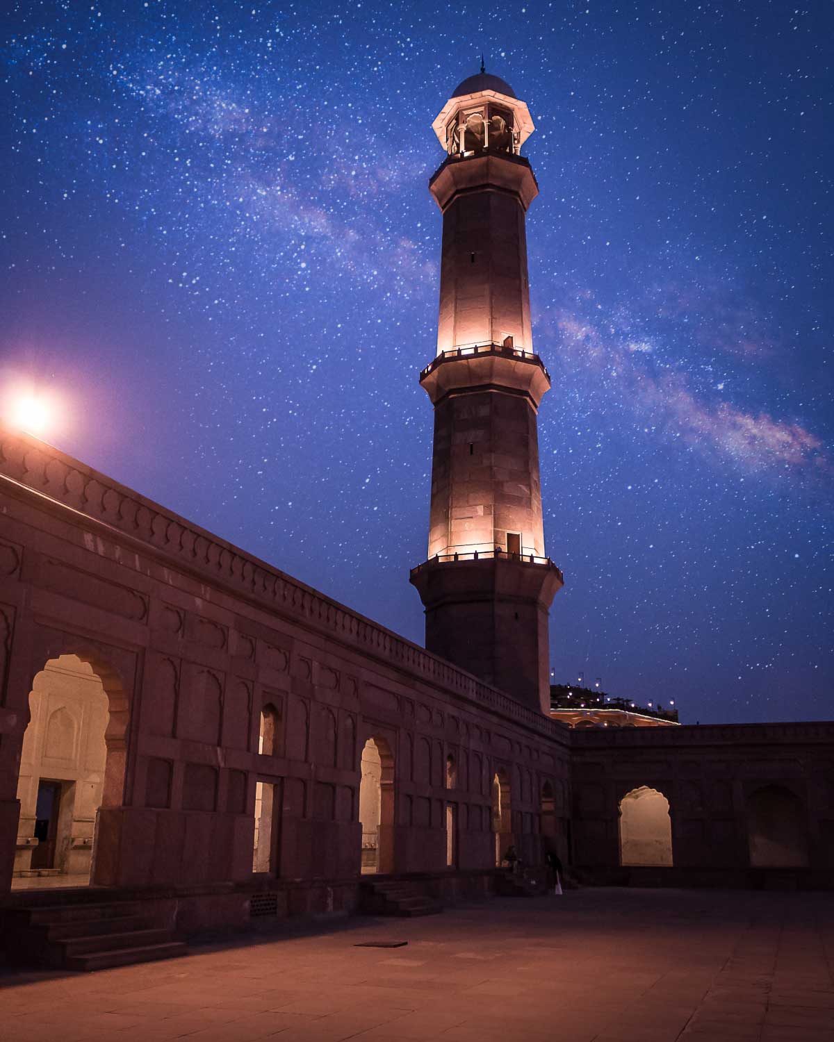 The old observatory is lit up, and the night sky is full of stars.