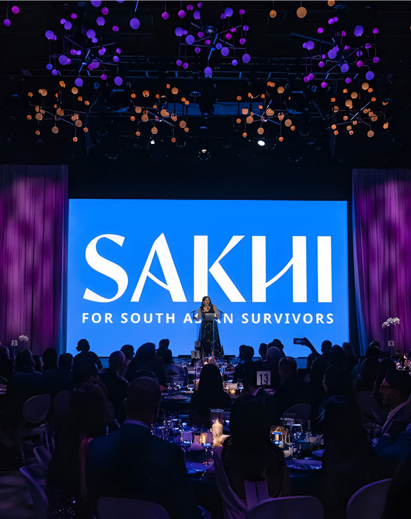 Sakhi for south asian survivors event photo with a new Sakhi logo behind