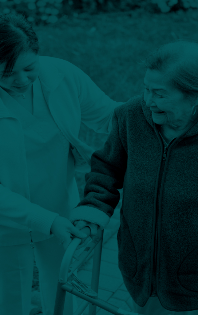 nurse helping an older woman in healthcare system