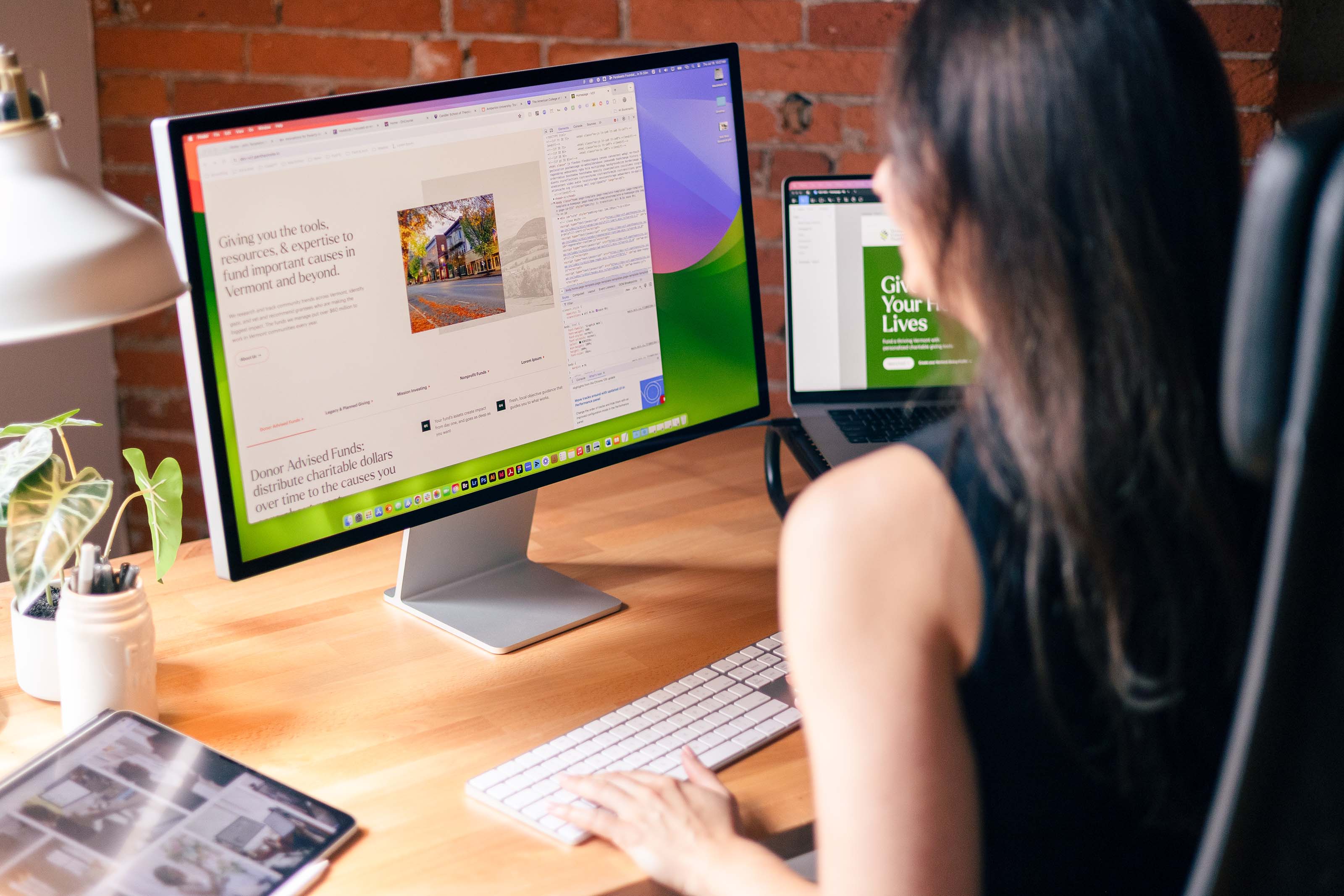 nonprofit website designer working at desk